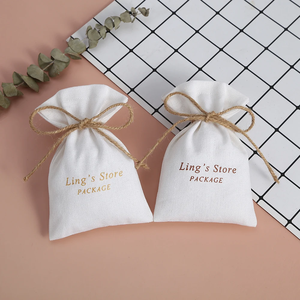 

100pcs Drawing White Cotton Burlap Jewelry Bag Jewelry Packing Small Pouches for Wedding Party Candy Bag Gift Bag Custom Logo