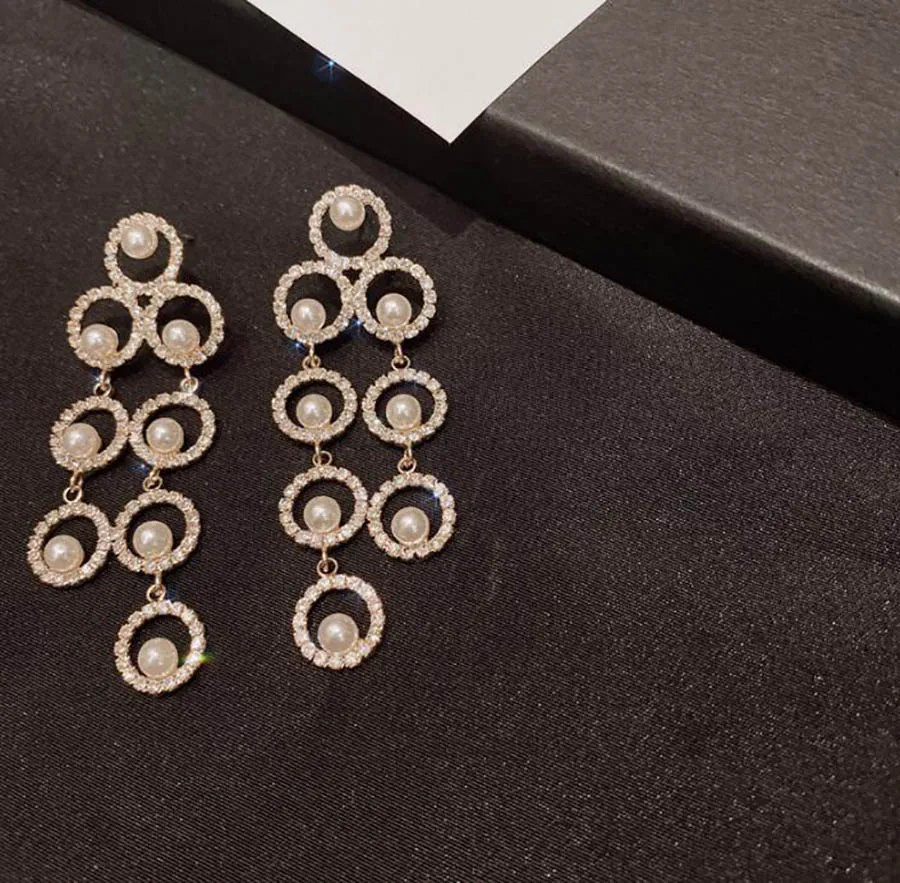 

Fashionable Korean sweet advanced elegant women hollow round pearl long earring gorgeous women tender ciecle wedding eardrop