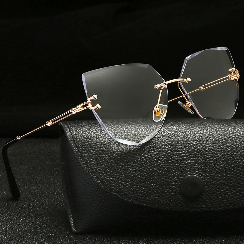 

2021 New Luxury Fashion Sexy Cat Eye Sunglasses Women Rimless Wave Sun Glasses Metal Shades for Vintage Women Eyewear UV400