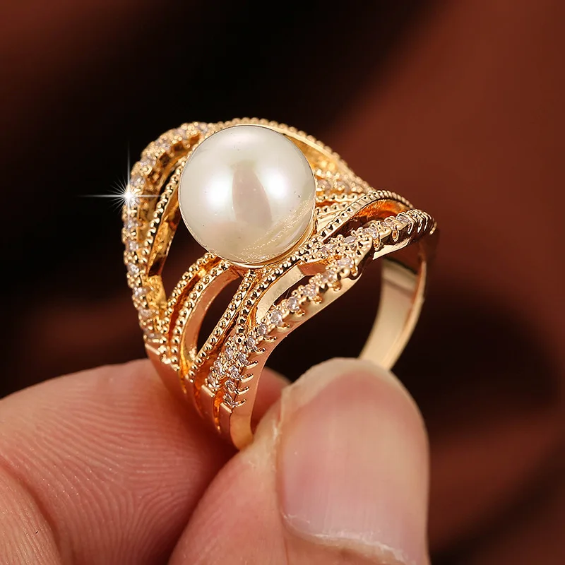 

2020 new European and American fashion trend jewelry pearl inlaid irregular hollow ring direct sales by women manufacturers