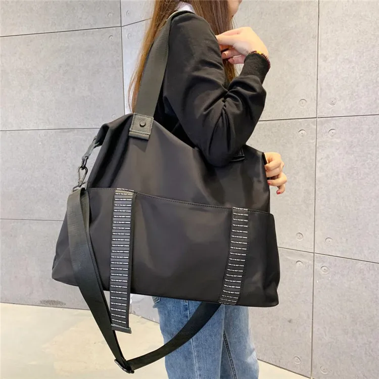 

Travelling bag woman hand bill of lading shoulder bag duffel bag Korean short distance large capacity Oxford cloth bag