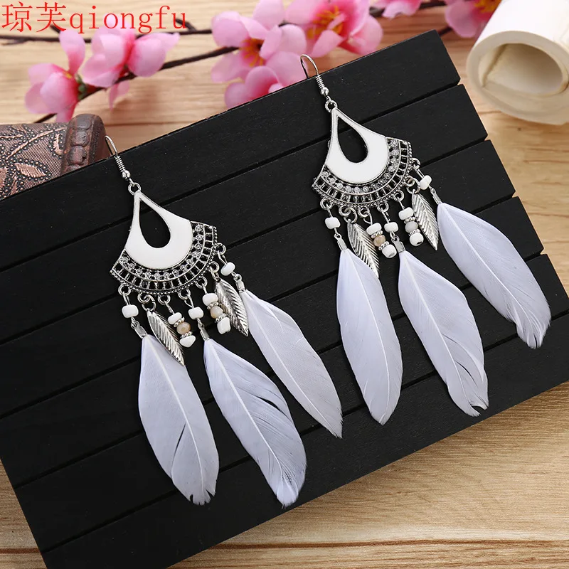 

Fashion earrings for women 2021Bohemian tassel feather female personality fan-shaped long earrings pendant dripping oil earrings