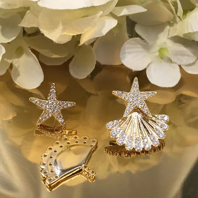 

Star shell earring personality sweet temperament compact S925 silver needle dual-purpose holiday wind starfish earrings