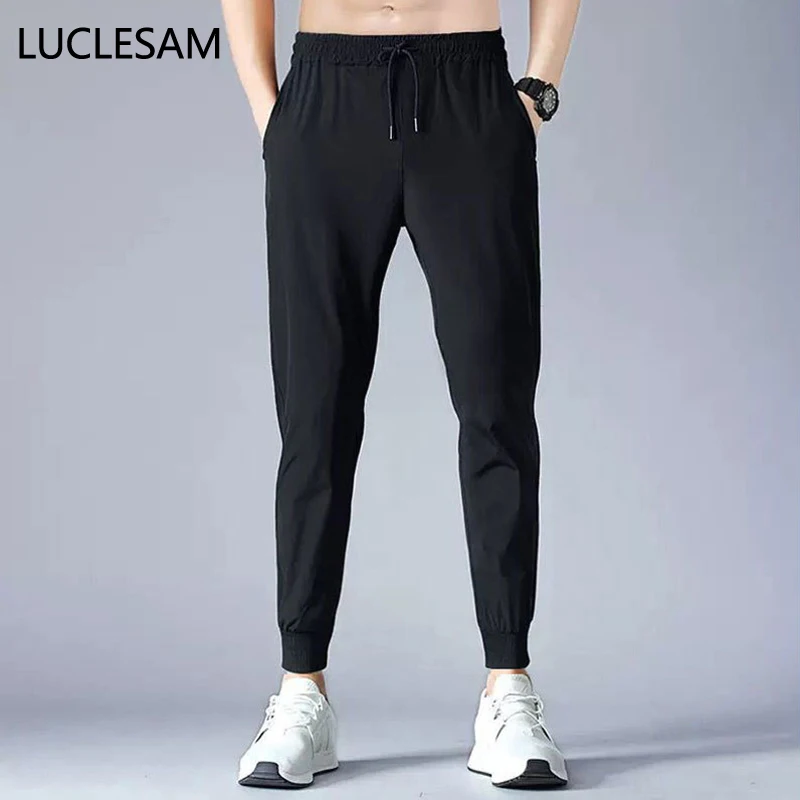 

Mens High Elasticity Sport Pants Mesh Hole Breathable Sweatpants Men Quick Dry Slim Fit Training Pants Beam Foot Jogger Trousers