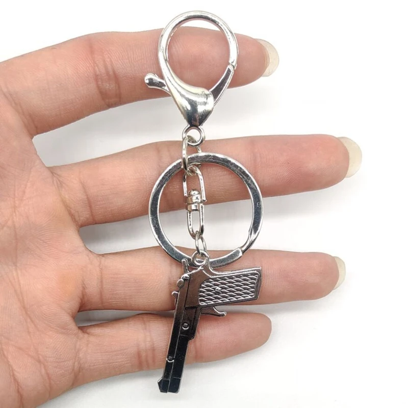 

2021 Fashion Black Technology Creative Gun Bullet Model Keychain Diy Keychain Accessories Hot Wholesale Hot Sale