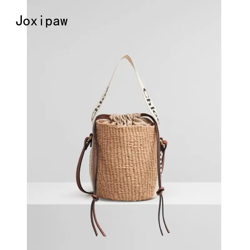 

2021 Spring and Summer New Net Red Straw Woven Bucket Bag Ribbon Letter Woven Bag Ladies One-Shoulder Diagonal Small Bag