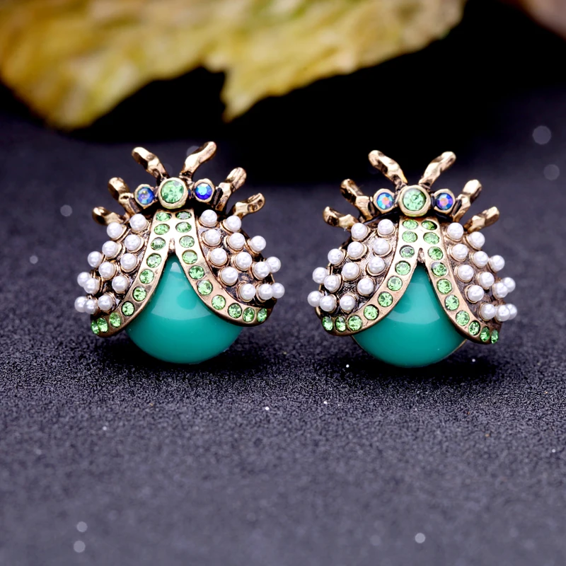 Женские серьги-гвоздики в виде божьей коровки с кристаллами золотого цвета |