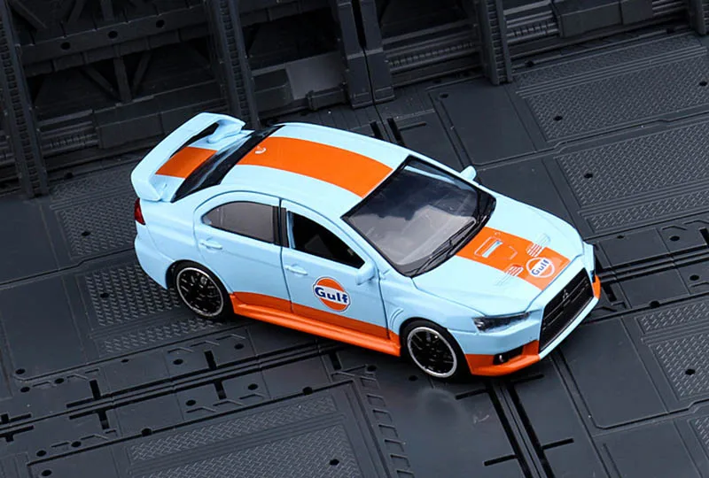 Модель игрушечного автомобиля Lancer EVO X 10 с изображением масла в заливе модель со