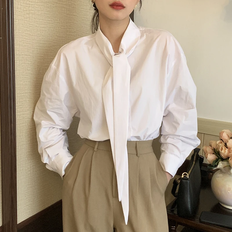 

Design sense of solid color pointed collar with single-breasted long-sleeved Blouses2022 Spring and Autumn New Simple Wind shirt