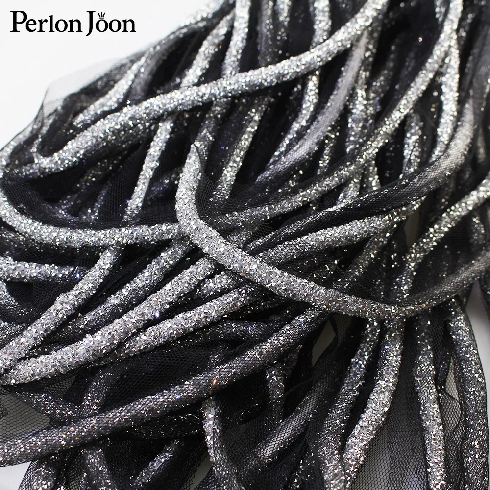 

1 yard, made of sparkling crystal the rope, black mesh at the bottom rhinestones trim sew on the clothing decoration accessories