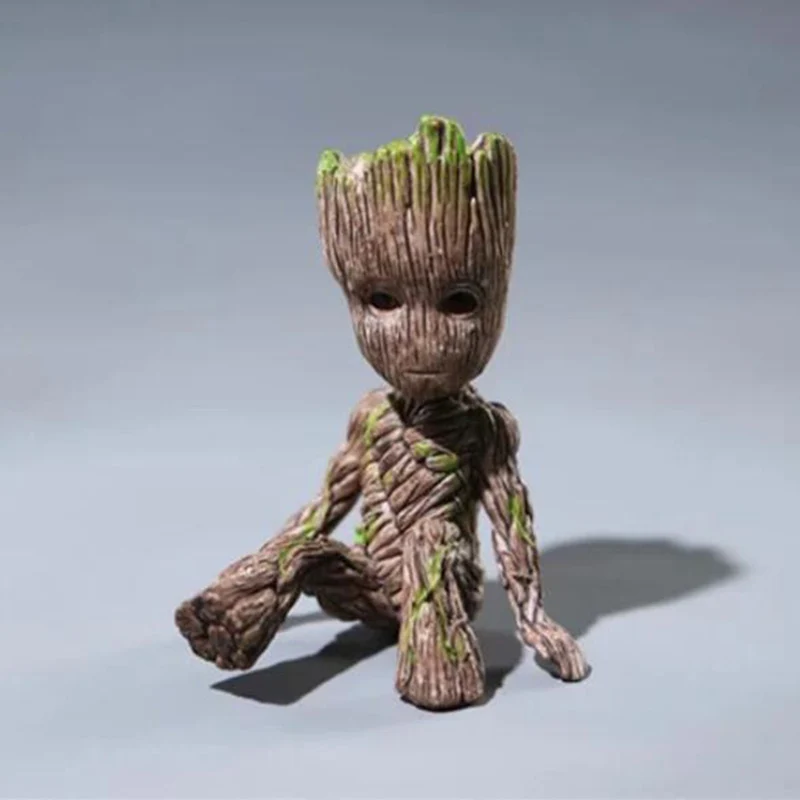 

Cartoon little tree man sitting posture puppet car interior with mini doll ornaments, car interior accessories
