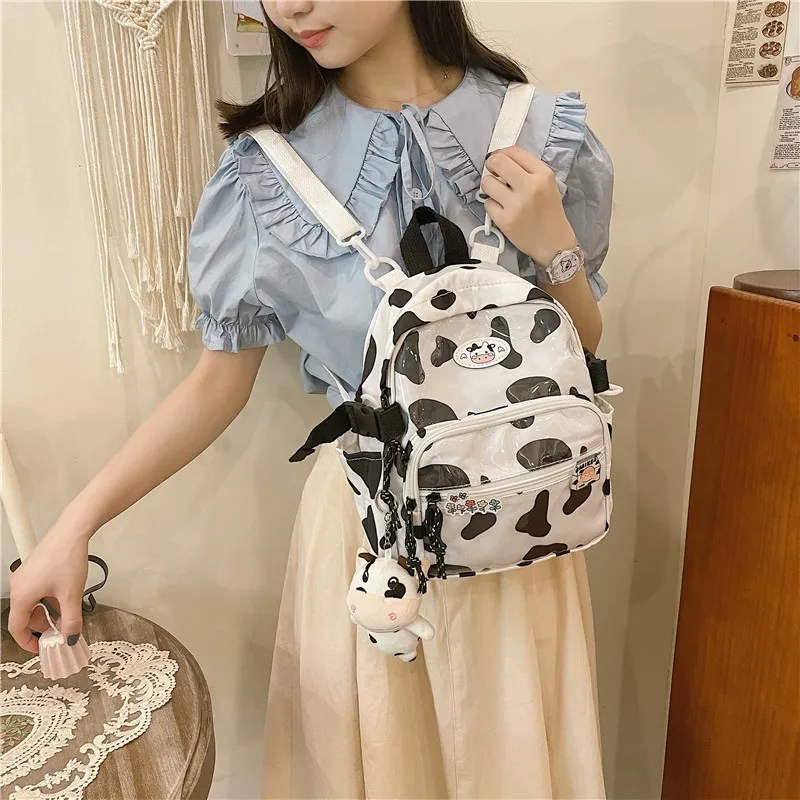 

Милые школьные ранцы с узором зебры для девочек, нейлоновые водонепроницаемые дорожные рюкзаки, Модный женский рюкзак с коровьим узором