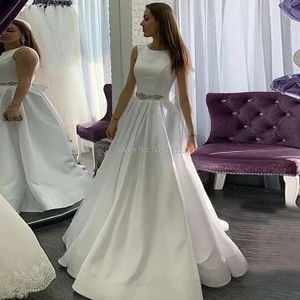 Elegant Satin A Line Wedding Dresses with Pockets Scoop Neckline Sleeveless Beaded Sash Bridal Gowns Ivory Vestido De Noiva 2021 Elegant Satin A Line Wedding Dresses with Pockets Scoop Neckline Sleeveless Beaded Sash Bridal Gowns Ivory Vestido De Noiva 2021
