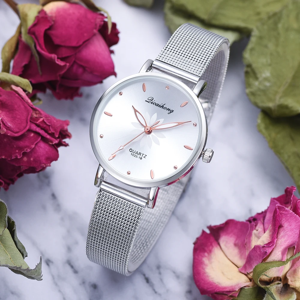 

The new ladies watch luxury silver fashion dial flower metal ladies bracelet quartz clock ladies watch new clock