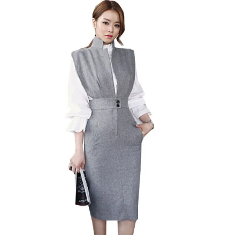 

Женский комплект из 2 предметов, белая блузка с воротником-стойкой и оборками и серая юбка-карандаш без рукавов с английским воротником, осе...