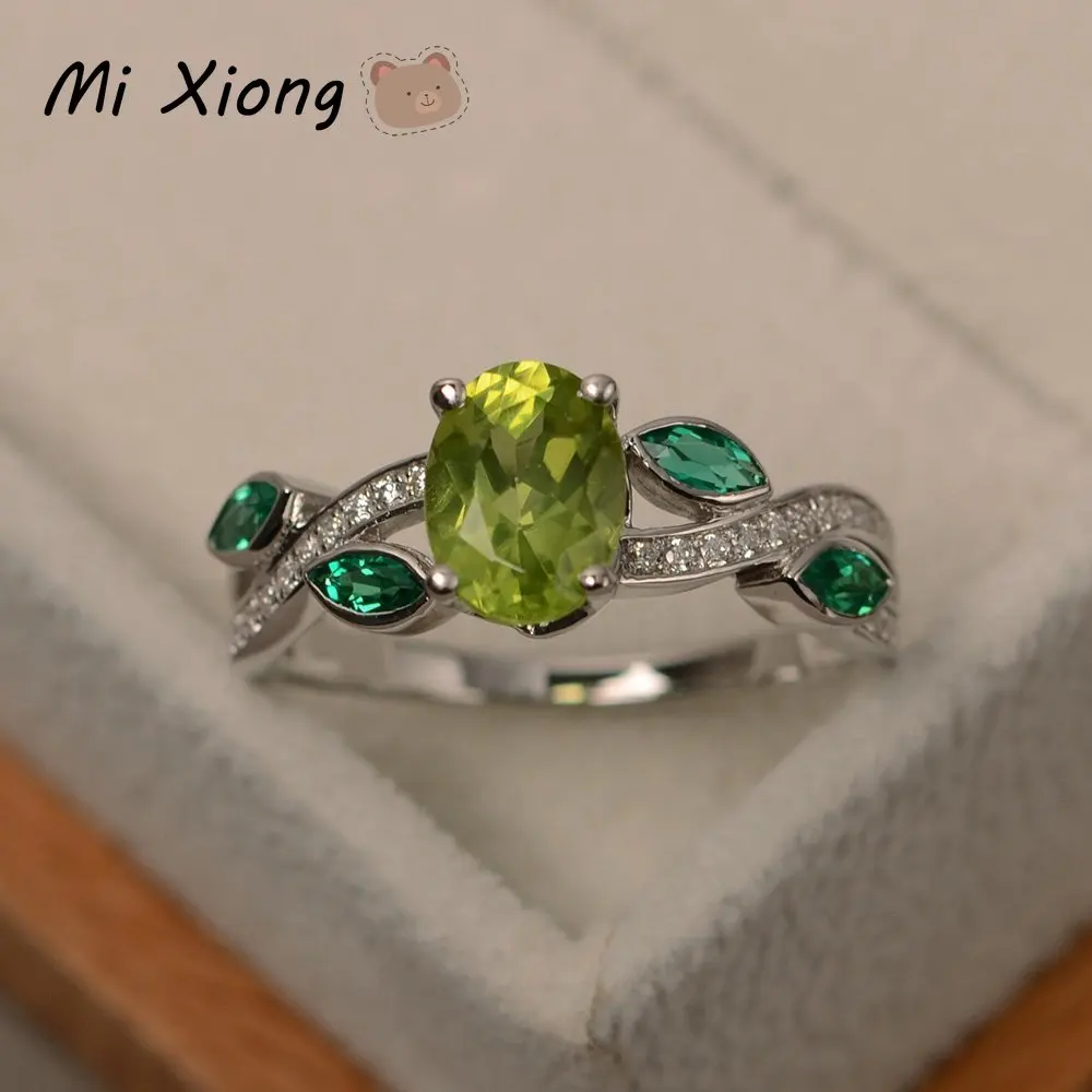 

Дизайнерское оригинальное новое кольцо Mi Xiong из стерлингового серебра s925 пробы с инкрустированным овальным кристаллом 11 цветов, поочередно...