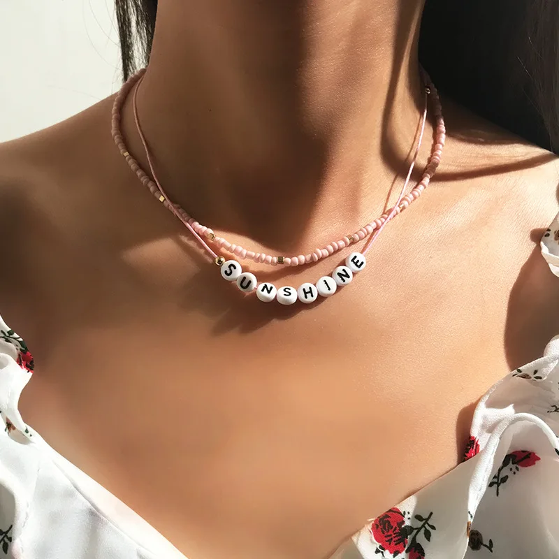 

2020 Wholesale European and American Fashion Jewelry Creative Pink Rice Bead Necklace Simple Letters SUNSHINE Clavicle Chain