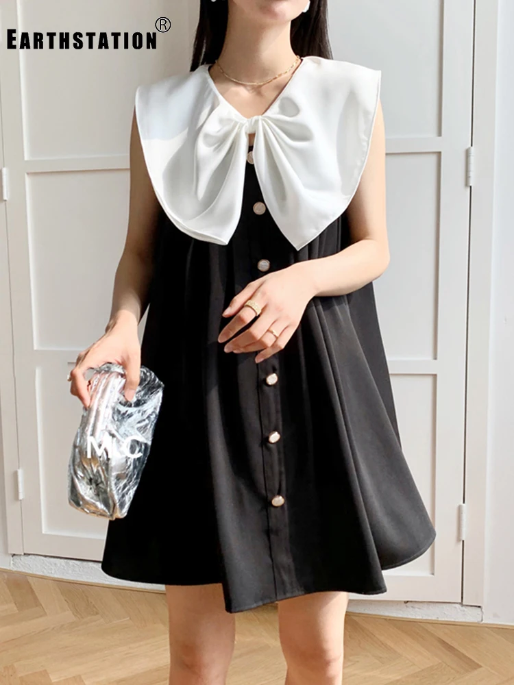 Черное и белое контрастное платье без рукавов с отстегивающимся бантом