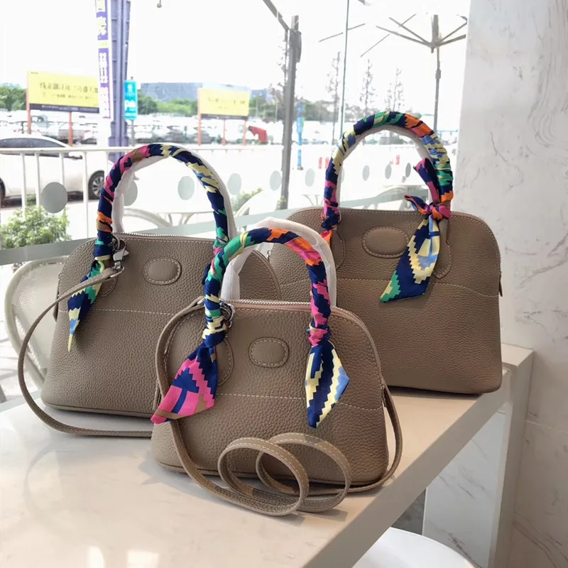 

The new 2020 litchi grain platinum baotou layer cowhide shell package one shoulder aslant leather mobile bowling female bag