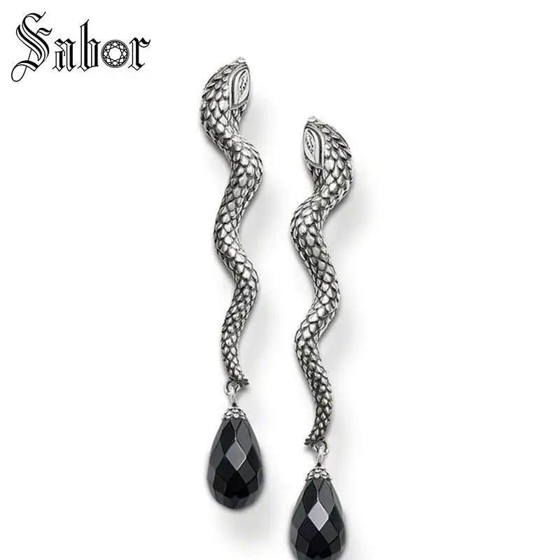 Серьги гвоздики серебристого цвета с кристаллами в вечерние