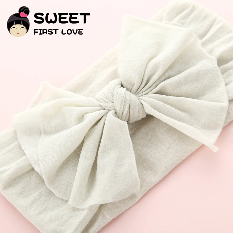 Повязка на голову женская с большим бантом нейлоновая мягкая эластичная лента