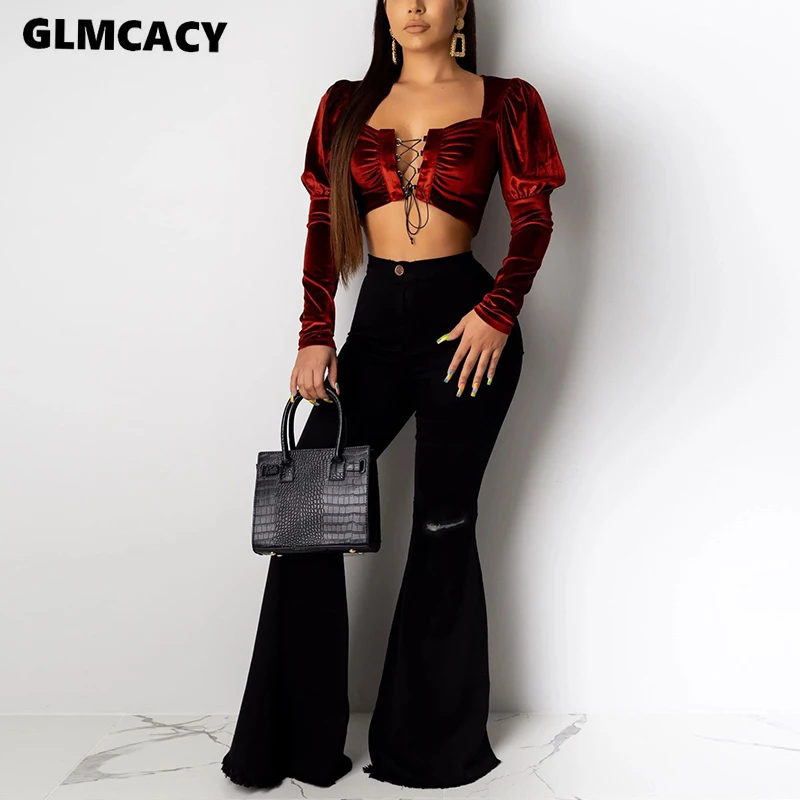 Женские расклешенные джинсы с высокой талией черные рваные широкими штанинами |