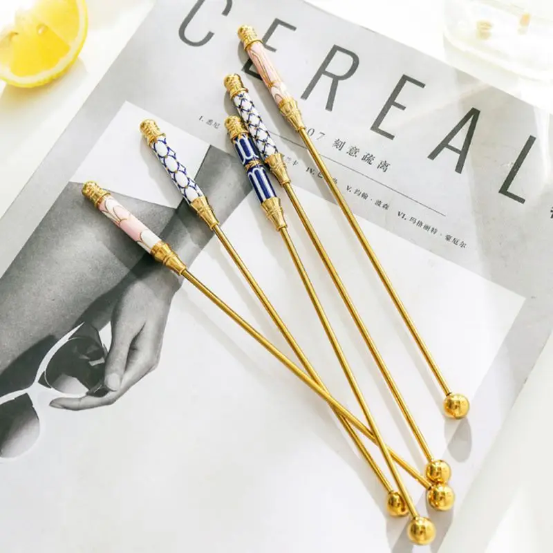 

Light Luxury Gold-plated Stainless Steel Coffee Beverage Stirrers Stir Cocktail Drink Swizzle Stick With Ceramic Handle