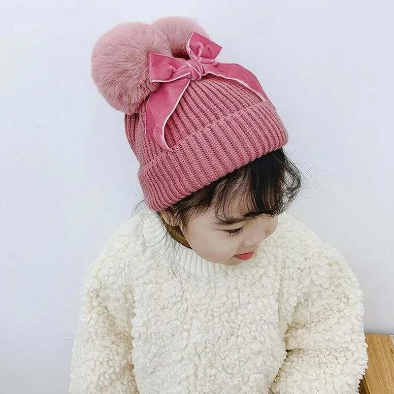 

1pcs Double Pompom Hat With Bowknot Cotton Wool Winter Warm Thicker Knitted Beanie Cap For Children Soft Pompom Hat