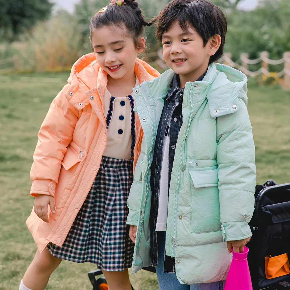 

Пуховик детский зимний средней и длинной с капюшоном и большими карманами