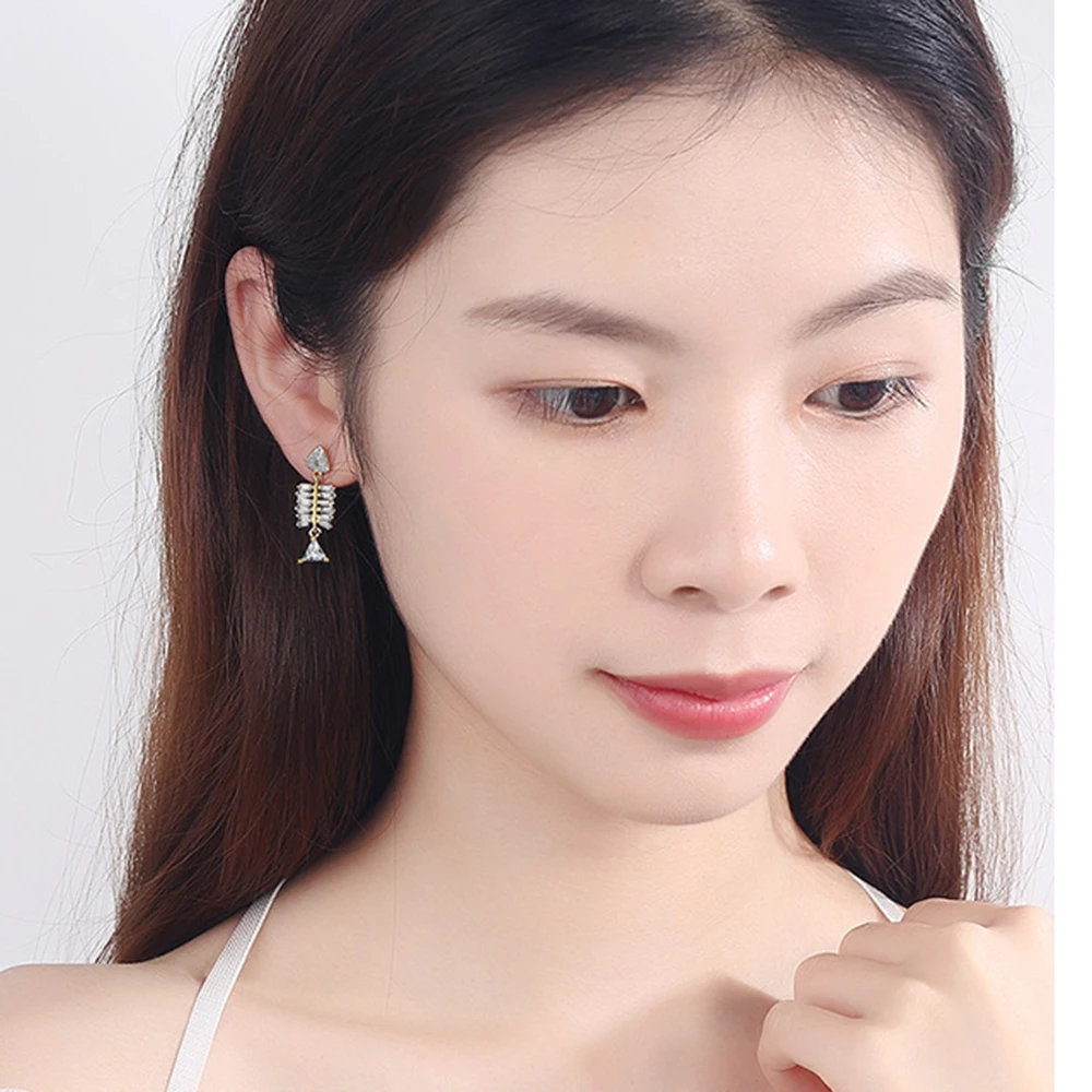 

Fish bone earrings female design earrings temperament Korean personality trendy ear jewelry inlaid zirconium earrings