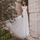 Платье свадебное из тюля с V-образным вырезом и жемчугом