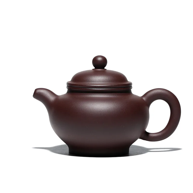 

Hand made teapot with purple clay