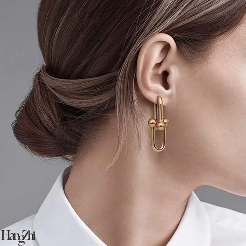 

Hangzhi new stars with the same retro golden buckle texture exaggerated hollow detachable chain earrings women's party jewelry