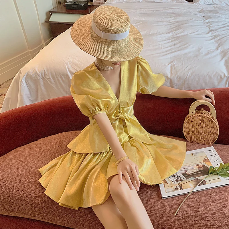 

2-Piece Women's Short Skirt Suit Elegant Lace-Up Top and Pleated Mini Skirt Summer Fashion Outfit Golden V-Neck Puff Sleeves
