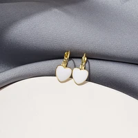 oe exquisite small milky white metal love earrings wholesale girls and women jewelry