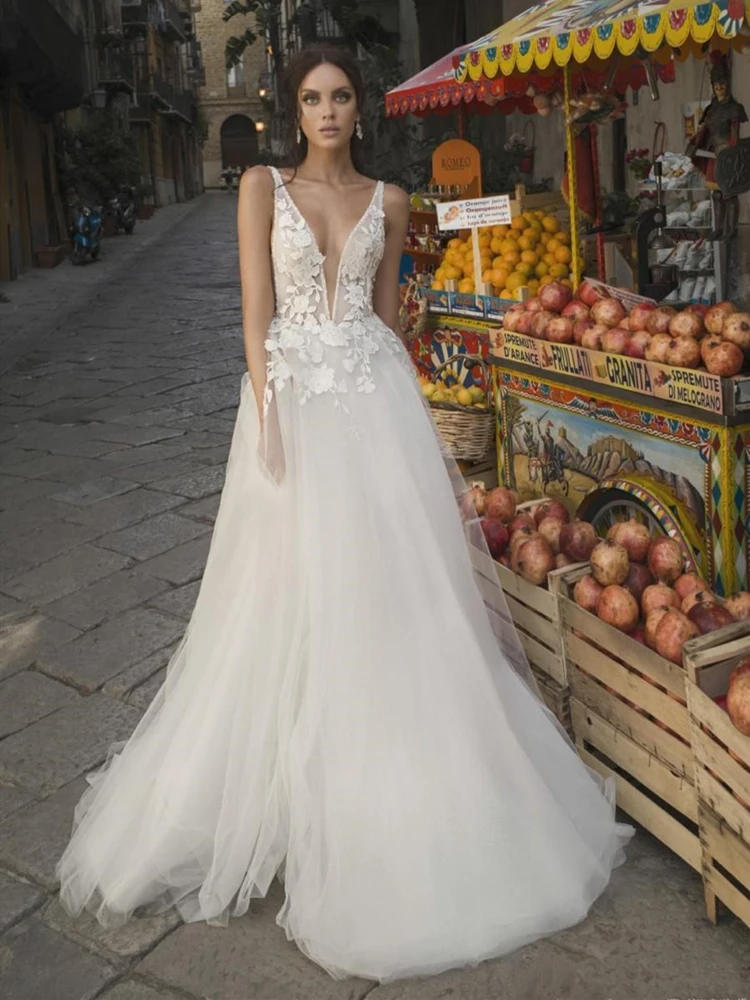 

Свадебное платье с глубоким v-образным вырезом, без рукавов, с вырезами по бокам, с цветочной аппликацией, кружевной тюль, а-силуэт, длина до п...