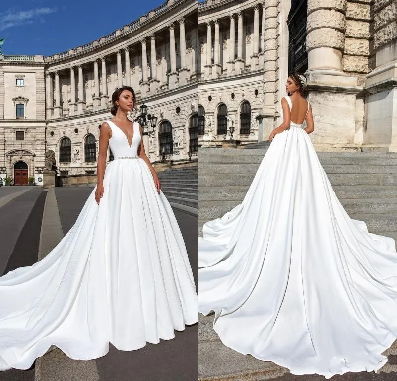

New Designer Backless Plus Size Wedding Dresses Cheap Deep V Neck Court Train Satin Wedding Dress Beaded Sashes Bridal Gowns