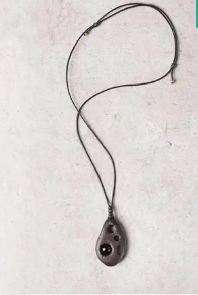 

Original handmade hollow inlaid obsidian ebony texture pendant
