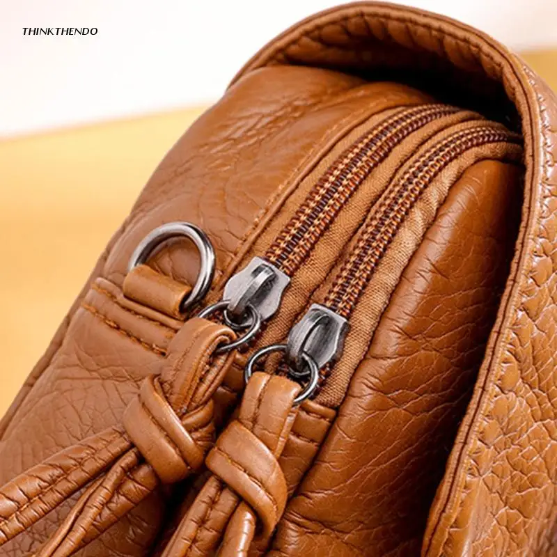 Сумка-мессенджер женская из кожи с регулируемым ремешком |