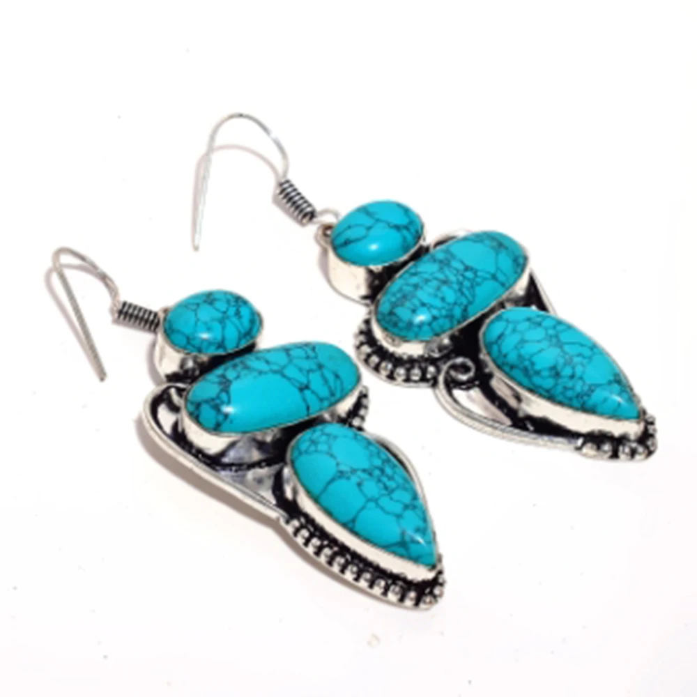 

Turquoise , Silver Overlay on Copper Earrings , 66 mm , E4576
