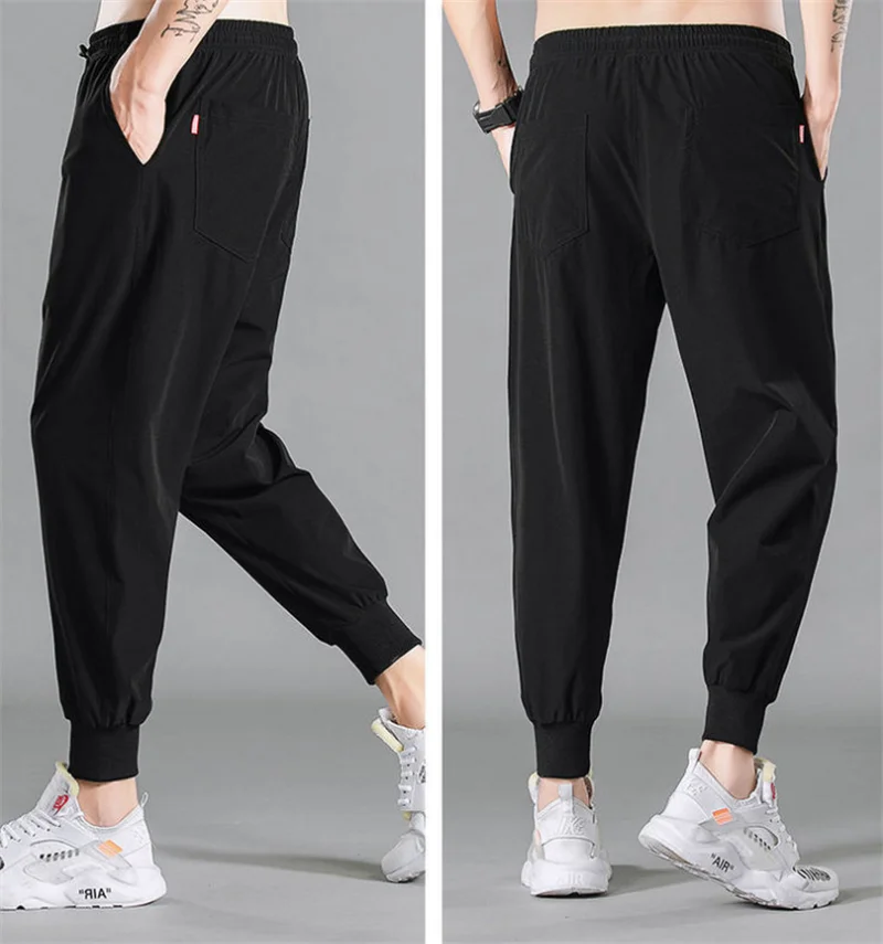 

2021 Summer Pants Men Thin Breathable Quick Dry Sweatpants Large Size 5XL Loose Casual Pants Slim Stretch Black Trousers Men