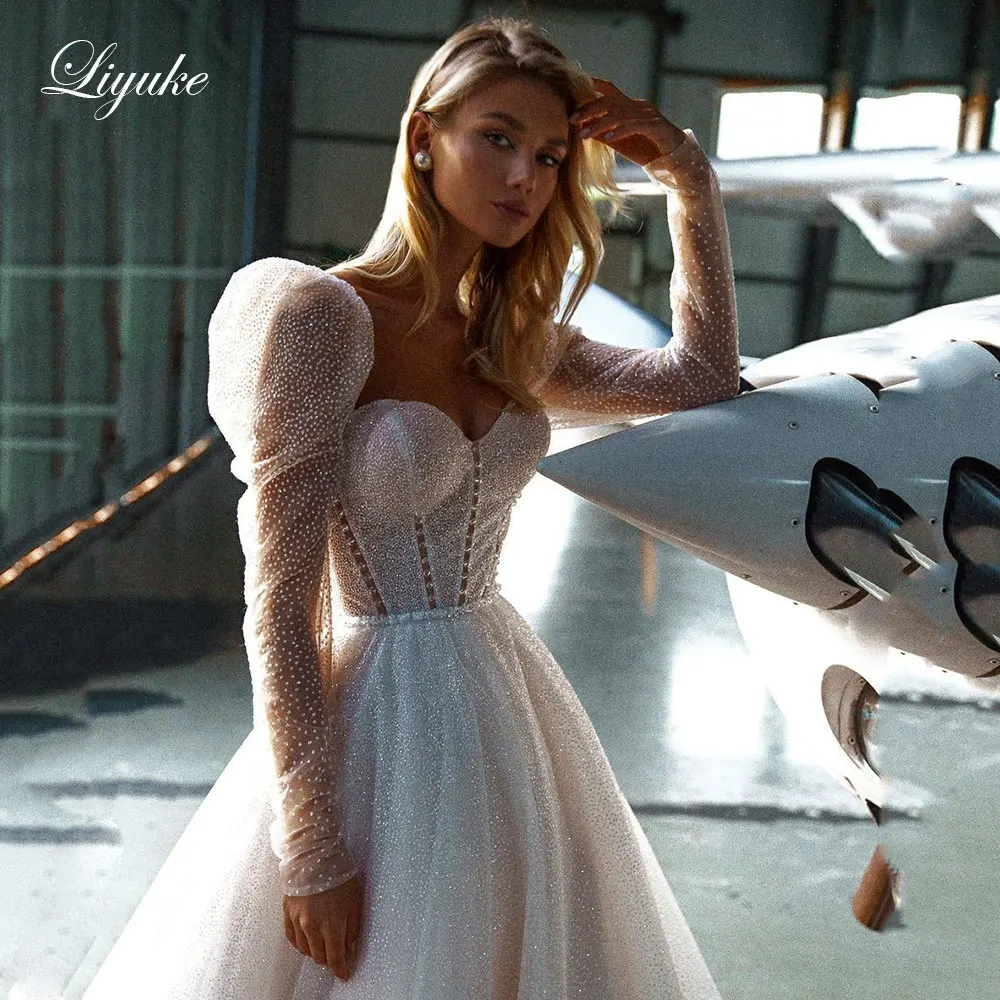 

Элегантное блестящее кружевное свадебное платье Liyuke трапециевидной формы с пышными рукавами, застежкой на пуговицы, открытой спиной