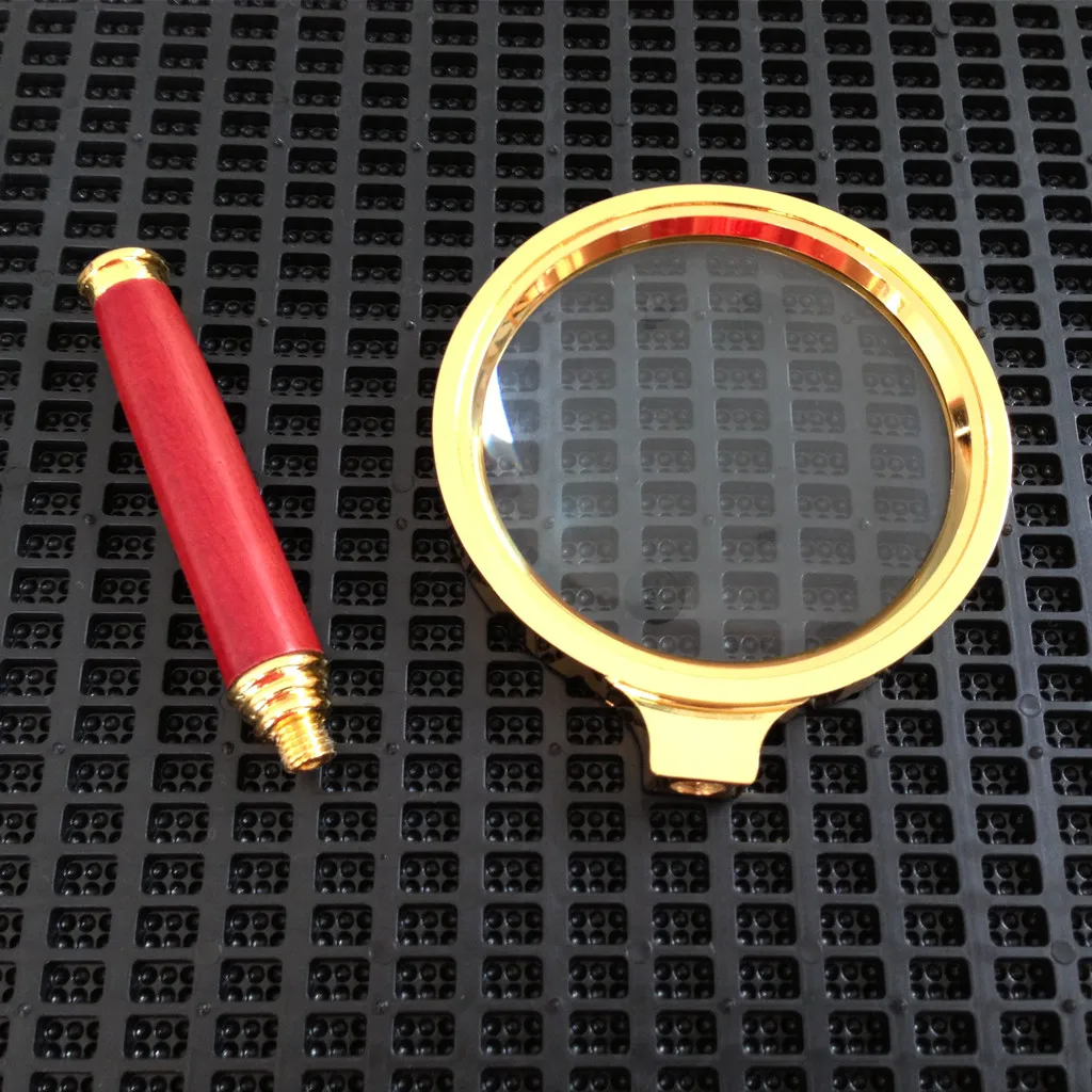 Лупа с золотистой оправой для ювелирных изделий ручная 80 мм 10 кратным