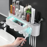 multifunctional wall mounted toothbrush holder with cup toothpaste squeezer dispenser storage organizer for bathroom accessories