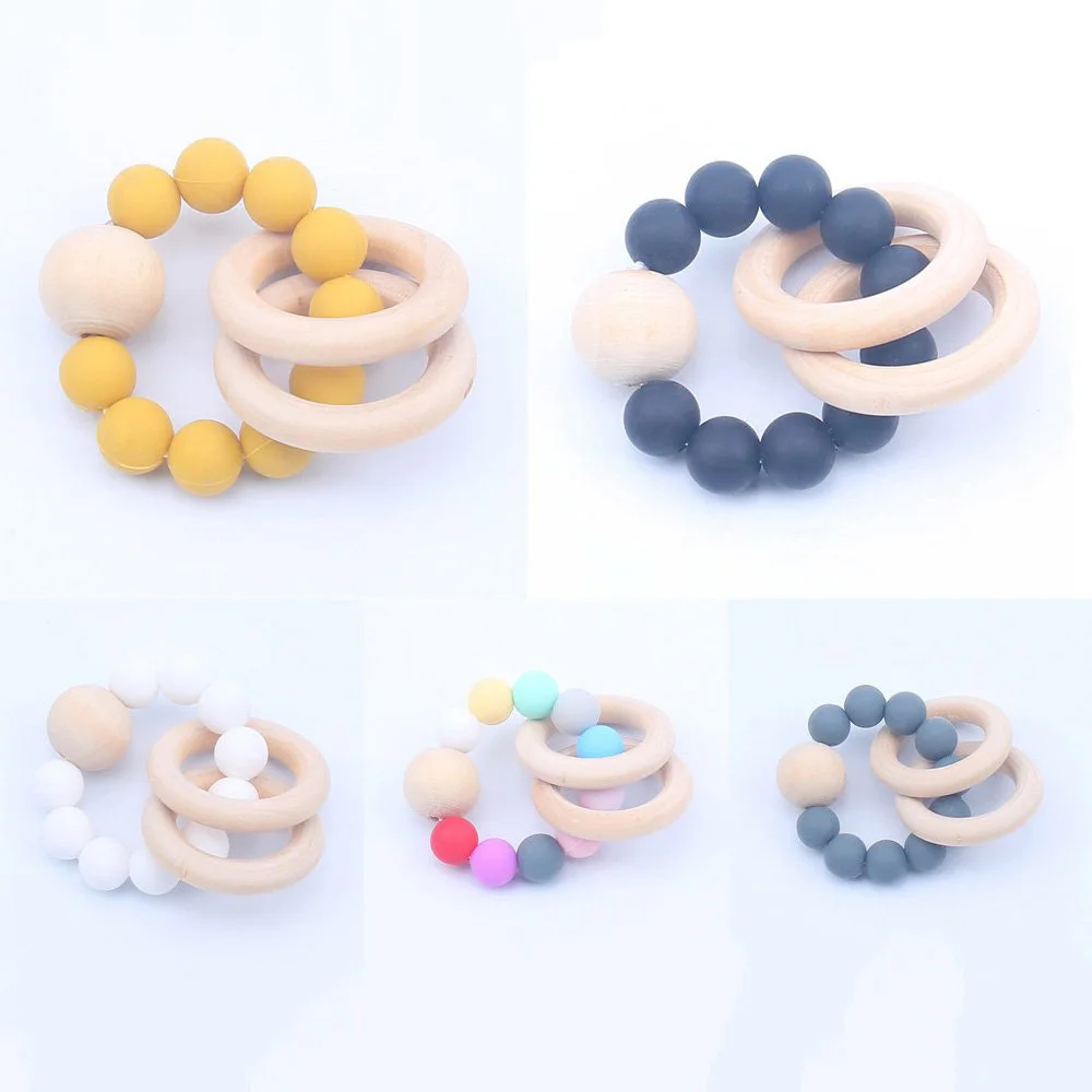 

Baby Teethers Nursing Bracelets Silicone Beads Wooden Rings Rattle Toy Infant Toddler Pacifier Chew Teething Toy Baby Care Toys