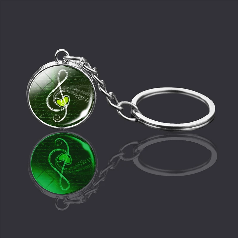 Световой с музыкальными знаками брелок двухсторонний стеклянный шар в виде