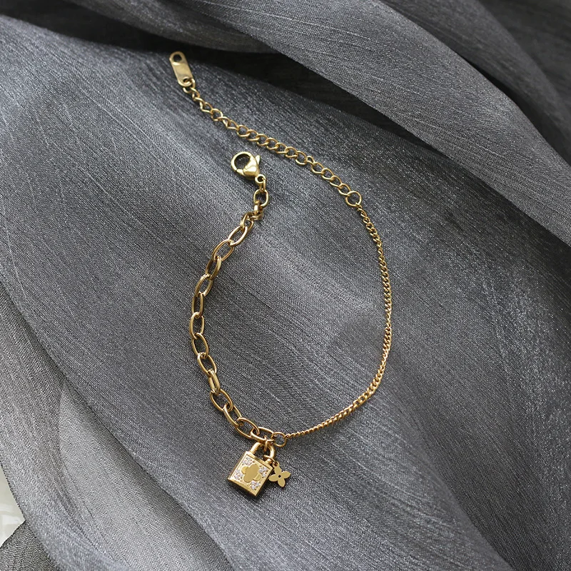 

2021 Stainles Steel 18k Gold Plated AAA Clear CZ Stone Paved Small Lock Flower Charm Asymmetric Chain Bracelets for Woman