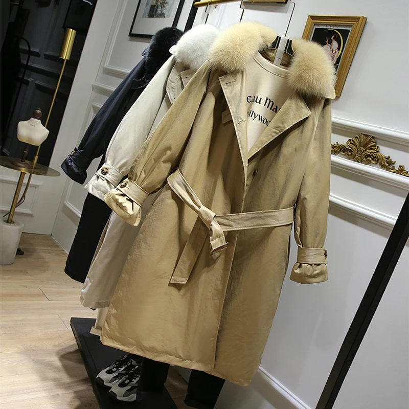 Женский пуховик с ремнем утепленный натуральным лисьим мехом длинное пуховое