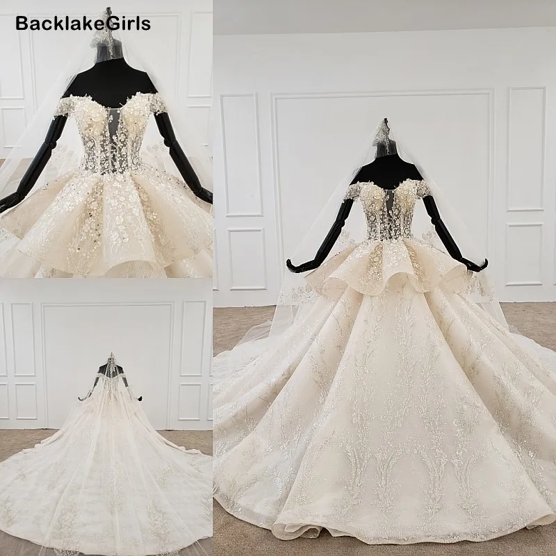 Свадебное платье в богемном стиле с объемным цветком бохо открытыми плечами