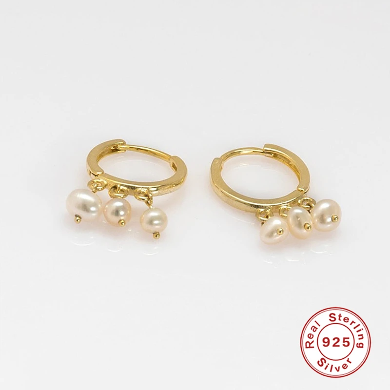 

Женские серьги-подвески из серебра с тремя жемчужинами